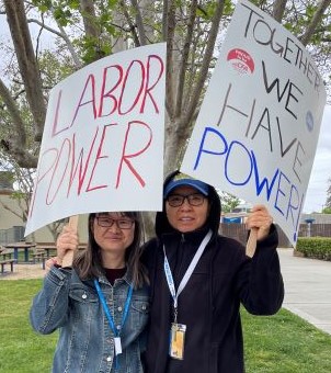 Two Asian members of CSUEU rally on May Day at SJSU